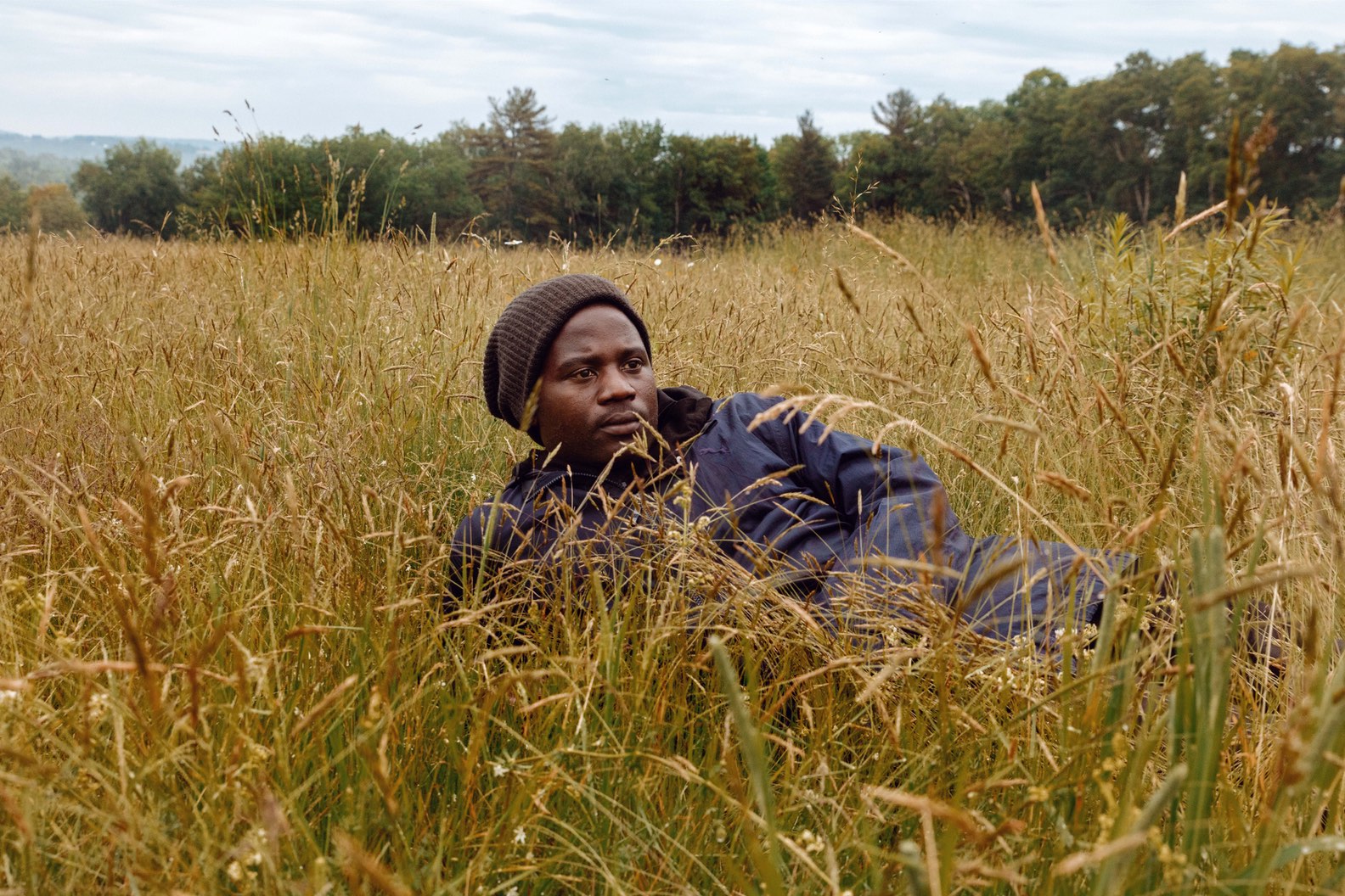 Man laying in grass, Gioncarlo Valentine ©2020, journal of wild culture 
