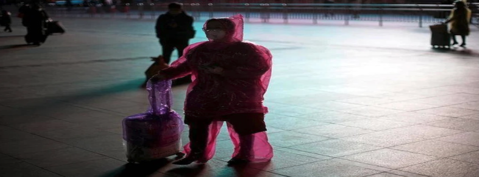 Covid traveller in rain coat, journal of wild culture ©2020